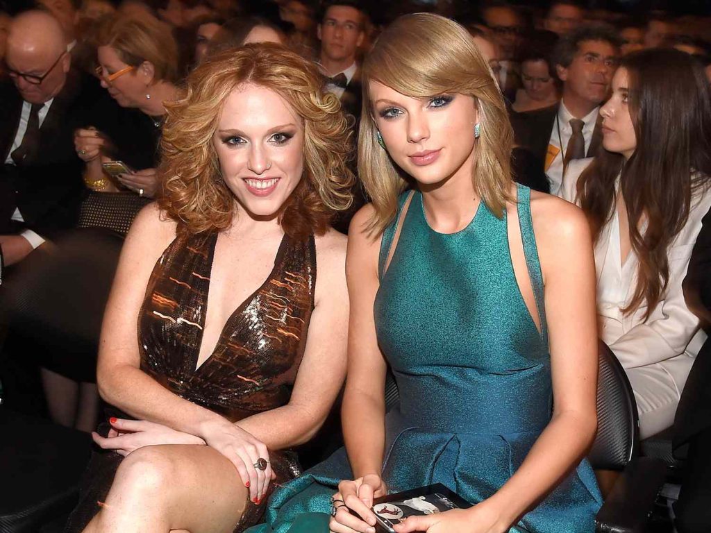 Alt Text: Taylor Swift poses with her longtime friend Abigail Anderson Berard.